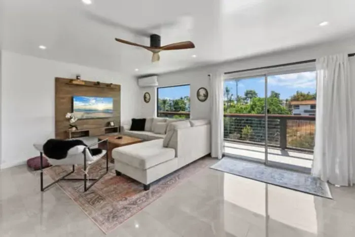 Contemporary comfort and natural light define this inviting space.