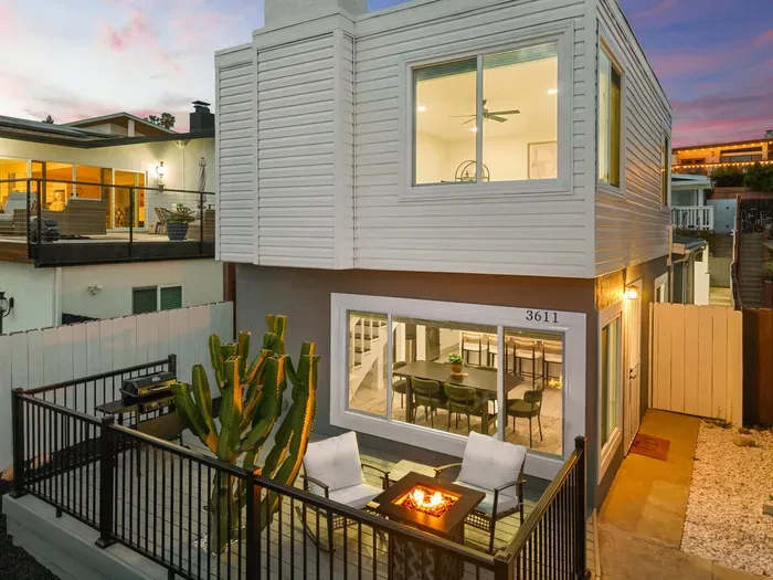 Modern home with fire pit patio, BBQ, and bright open dining area