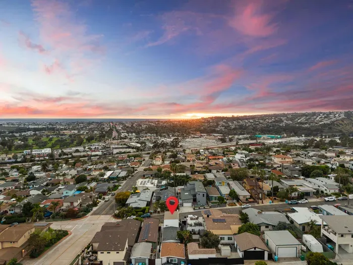 Coastal neighborhood gem with sunset skies and ocean-horizon views