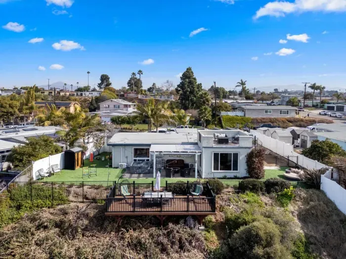 Spacious home with a private deck and scenic hillside views.