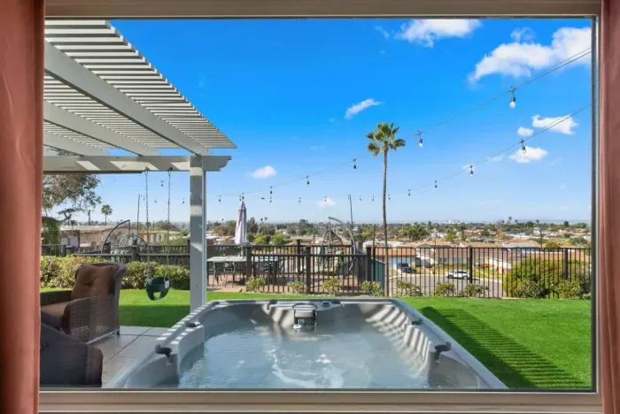 A stunning Airbnb with a private hot tub, outdoor seating, and breathtaking city views!