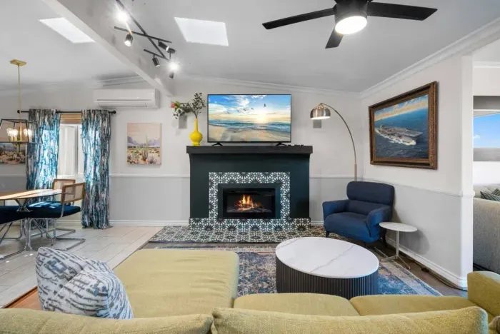 The living room is open to the kitchen and dining area