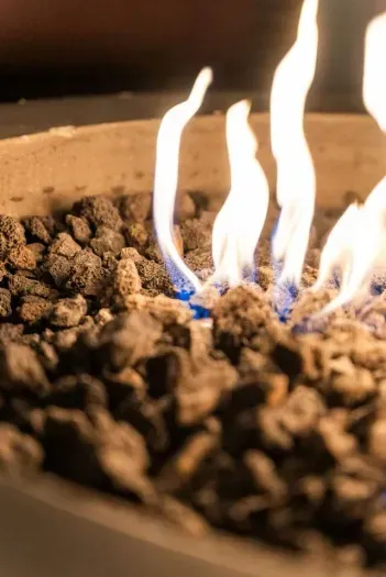 Cozy up by the warm glow of our fire pit.