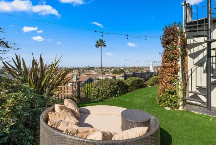 Relax in a cozy outdoor lounge with stunning city views.