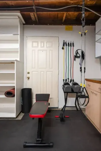 Fully equipped home gym with weights, resistance bands, and TRX!