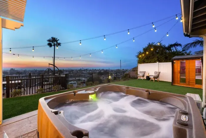 Soak in the hot tub and enjoy the beautiful views