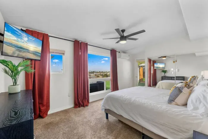A modern and cozy Airbnb bedroom with a scenic view, stylish decor, and comfortable amenities.
