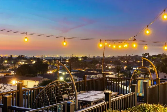 Experience breathtaking city views under warm string lights