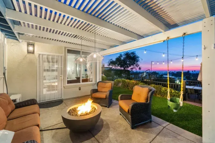 Relax in this cozy patio with stunning sunset views and a warm fire pit.