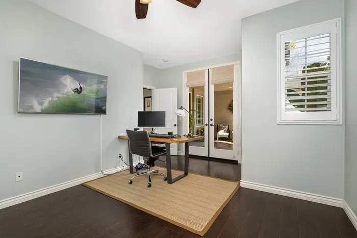 Bedroom 5 is a combination office/bedroom. It has french doors to access separately from the front entrance and features a pull out sofa that turns into a queen bed, as well as an ensuite full bathroom