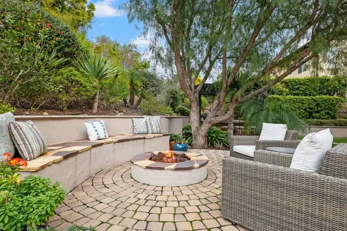 The outdoor fire pit has plenty of seating for your group to enjoy