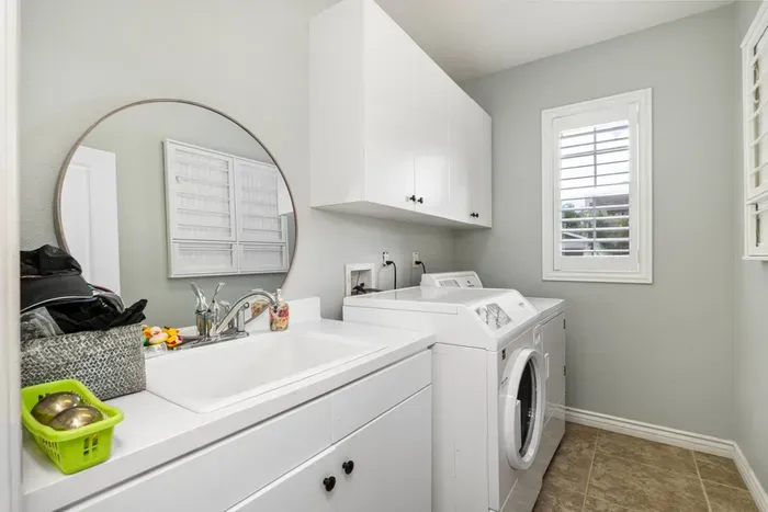 Laundry room with washer, dryer and sink