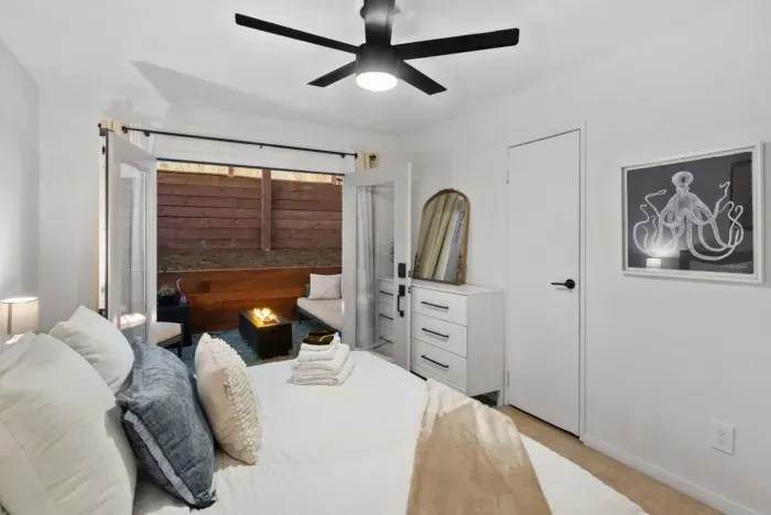 Chic bedroom with patio firepit