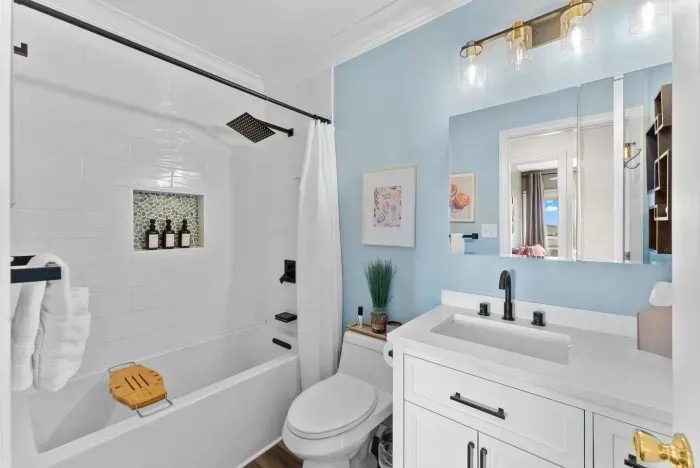 Fresh bathroom with light blue walls and modern fixtures