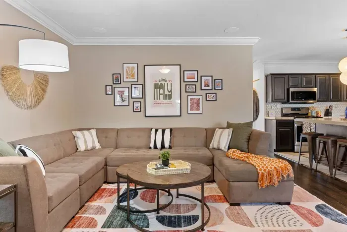 Living room with plush sectional and modern Italian decor