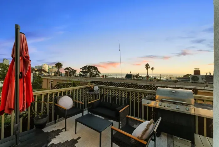 Balcony access and sunset views of the bay