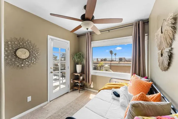 Airy bedroom with French doors that open to fresh ocean breezes