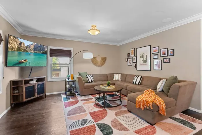 Bright living room with sectional sofa and colorful accents