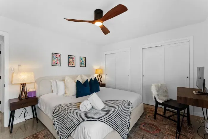 Guest bedroom with king bed, styled for comfort and rest.