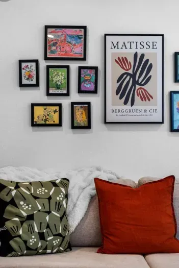 Living room with curated gallery wall and ample seating.