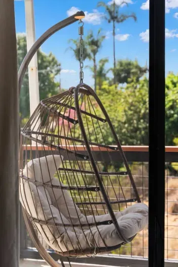 Cozy hanging chair to unwind in your personal outdoor space.
