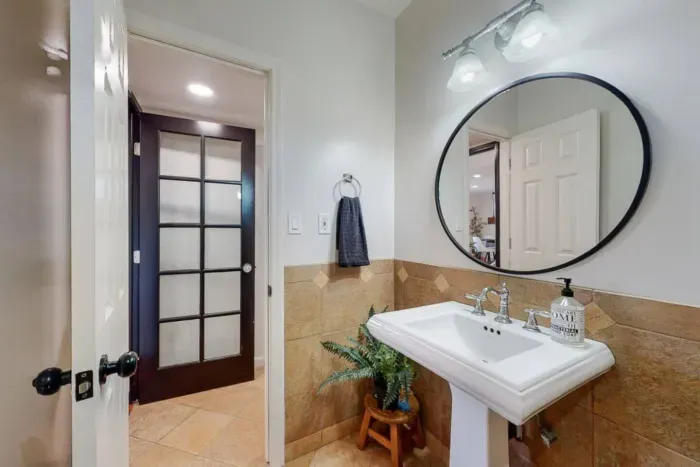 Stylish circular mirror for a modern touch.