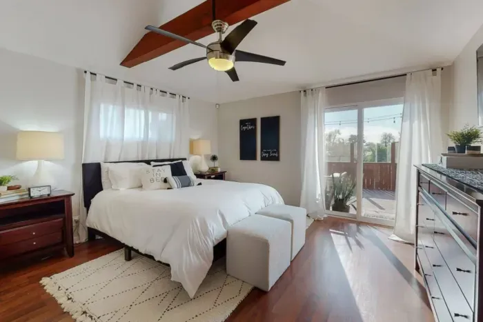 Bedroom with direct access to a charming backyard.