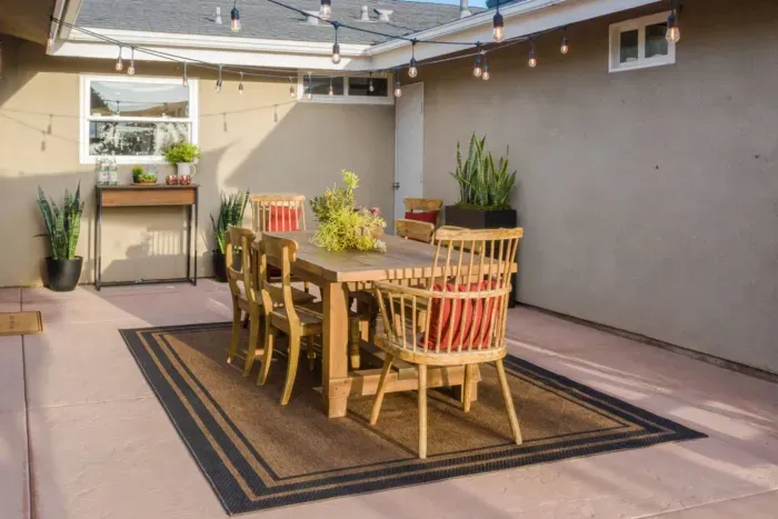 Beautifully designed alfresco dining area in the backyard for enjoying meals outdoors.