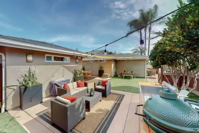 Private gas grill and furnishings for outdoor dining and relaxation.