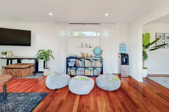 Mini-library in the living room for book enthusiasts to enjoy.