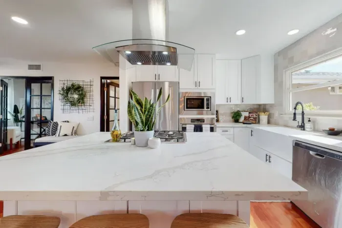 Spacious kitchen with modern appliances for culinary convenience.