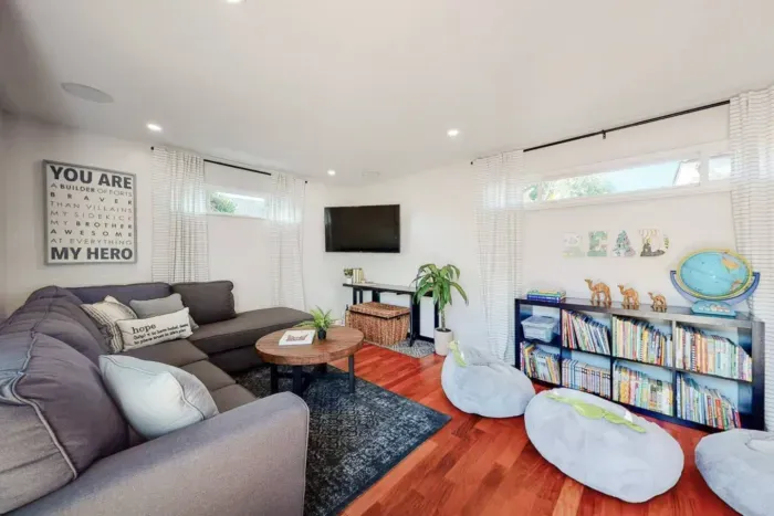 Living room with a cozy mini-library for relaxation and reading.