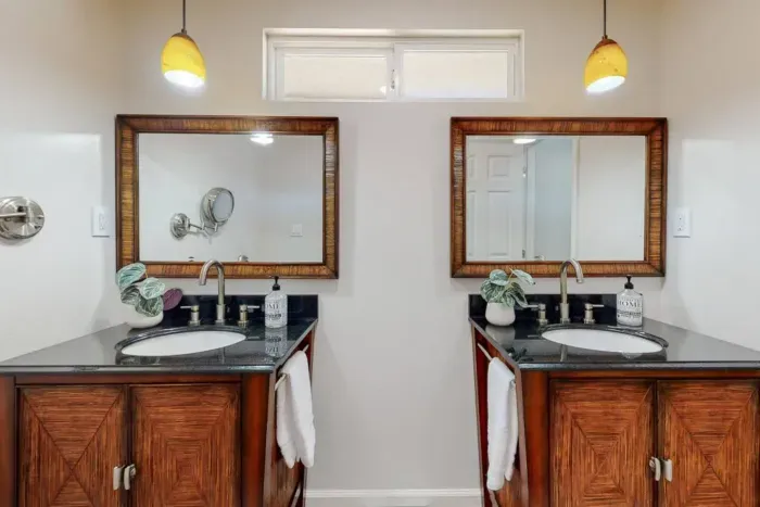 Bathroom with dual sinks and mirrors for convenience and style.
