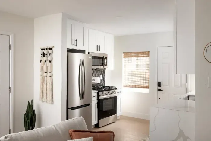 Prepare your favorite recipes with a gas range, ample counter space, and modern design details.