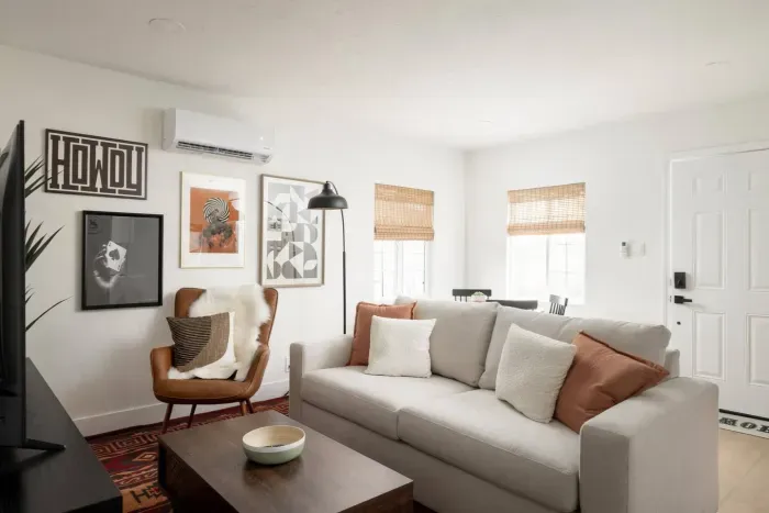 Sink into the oversized sectional and enjoy a bright, airy space that blends comfort with boutique design.