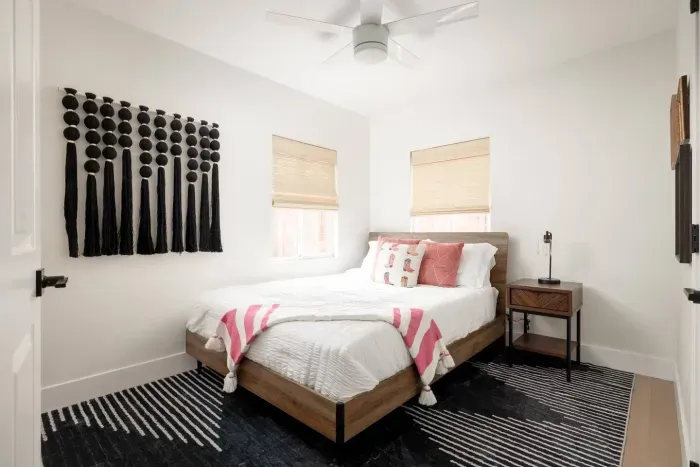 Styled with bold accents and soft bedding, offering a restful retreat after a day of exploring.