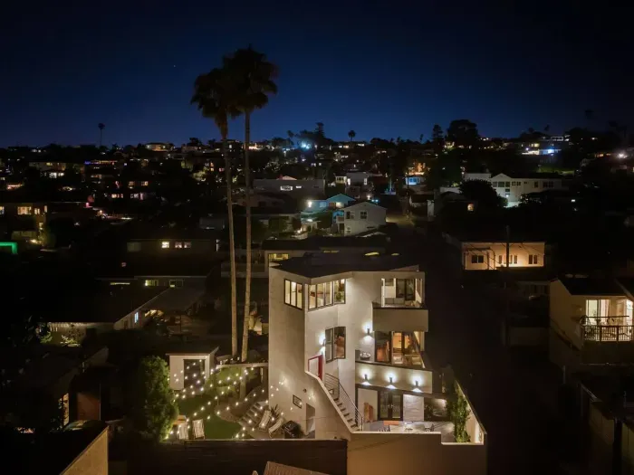 Nighttime view of Ocean Beach sparkling with lights