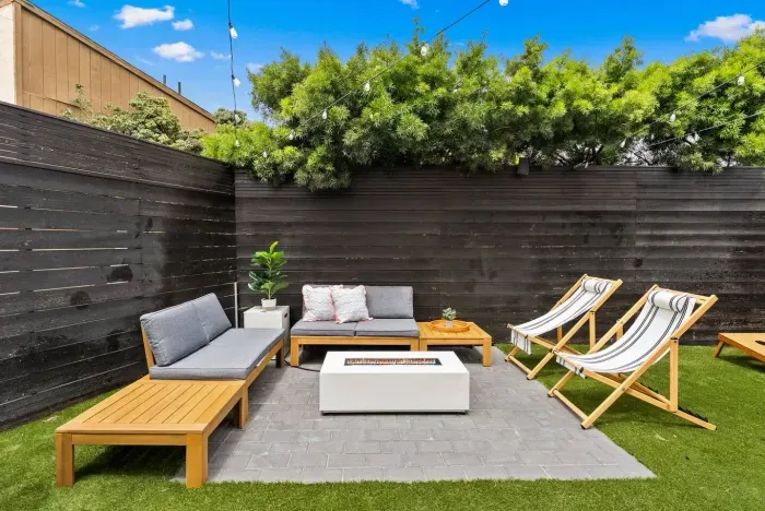 Outdoor sectional surrounded by lush greenery
