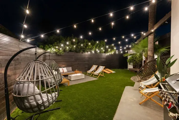 Fire pit lounge area under the string lights