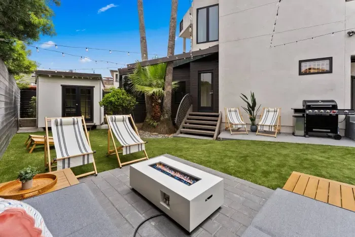 Inviting yard with fire pit and loungers