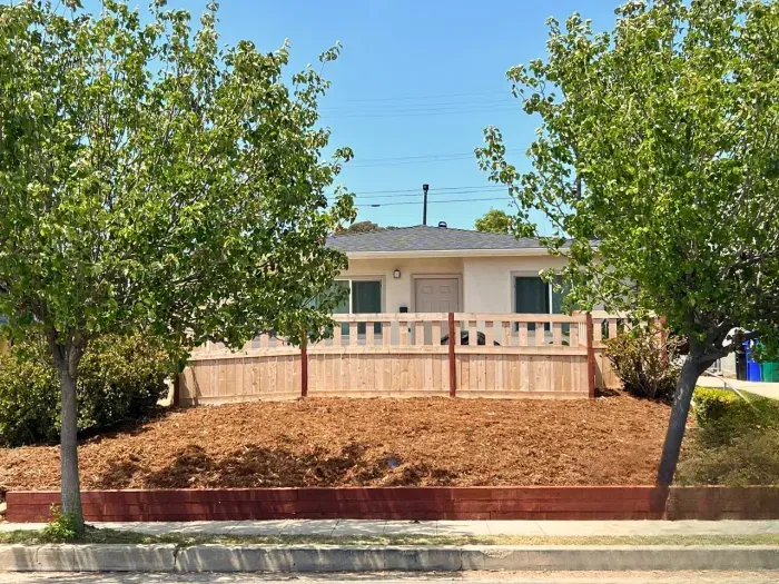 A sweet, quiet front view—your own little cottage tucked behind the trees.