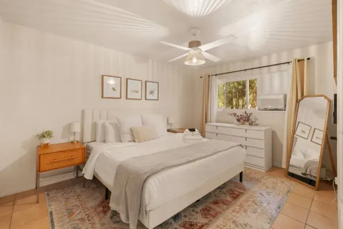 Inviting and cozy bedroom with comfortable bedding for a restful night's sleep.