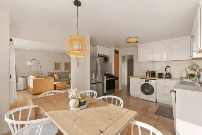 Open concept living between the dining, living and kitchen areas