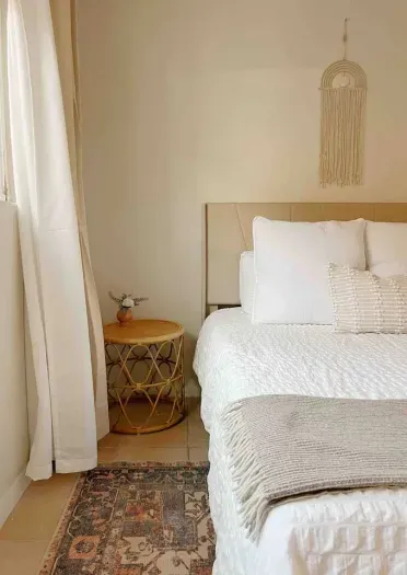 Beautifully designed side tables enhance the elegance of the bedroom.