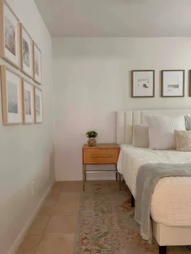 Cozy bedroom featuring a convenient side table for your bedside essentials.