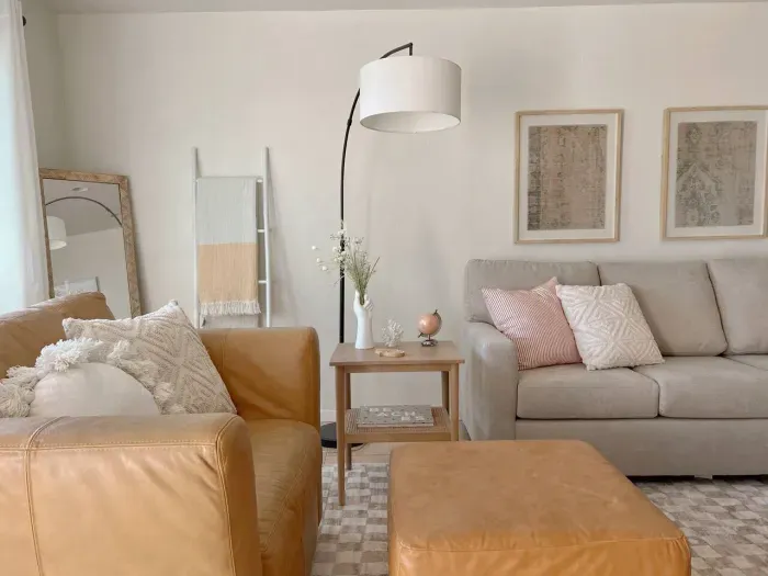 Bright and cozy living room with modern decor and comfortable seating.