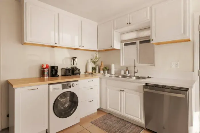 Kitchen with a dishwasher and a combo washer/dryer for your use