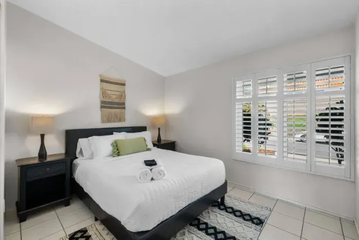 Chic and comfortable bedroom with a warm, inviting vibe!