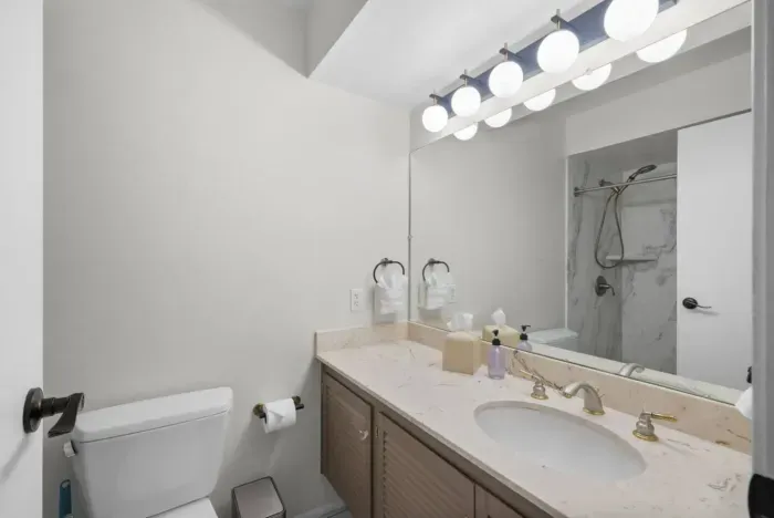 Bathroom 2 is in the hallway has a shower with a bench in it. We also have a separate baby/toddler bath tub you can use in here if needed!