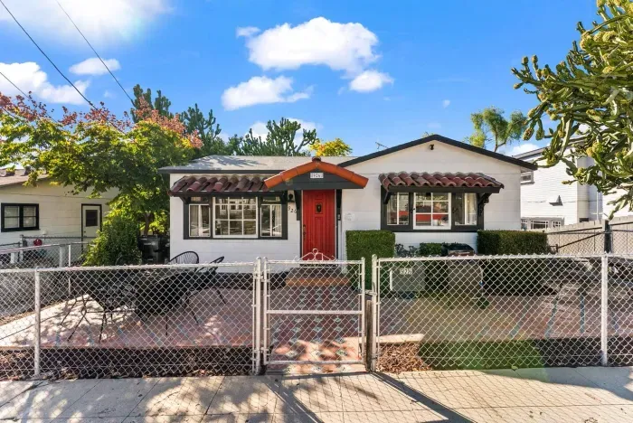 Front-yard view of the home, showcasing its welcoming architecture and sunny exterior.